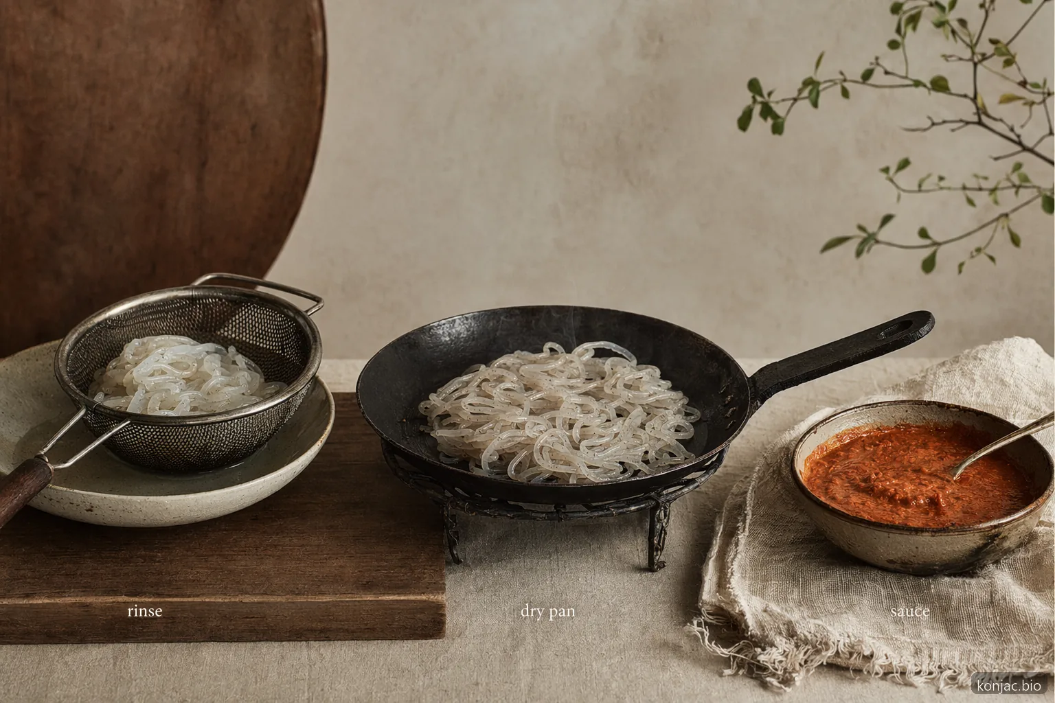 Konjac pasta cooking setup shows rinsing, dry-pan heating, and bold sauce improve noodle texture.